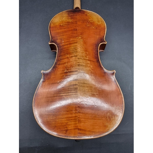 1647 - An antique Continental violin, with 14in two-piece back, with three various bows. (4)... 