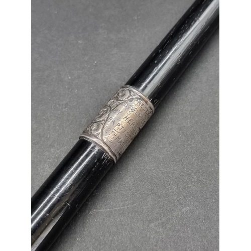 1648 - An ebonised and silver mounted conductor's baton, inscribed 'Presented to Miss L G Griffiths, by Her... 