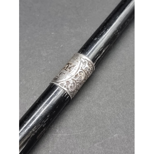 1648 - An ebonised and silver mounted conductor's baton, inscribed 'Presented to Miss L G Griffiths, by Her... 