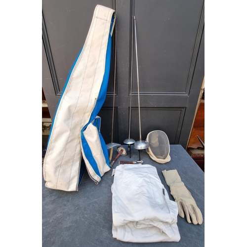 1653 - A collection of vintage fencing equipment, in bag.