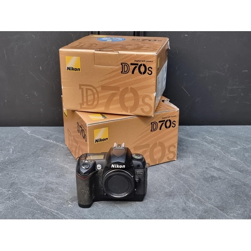 1655 - Cameras: two Nikon D70s bodies, each boxed, with battery charger and instruction manual.... 