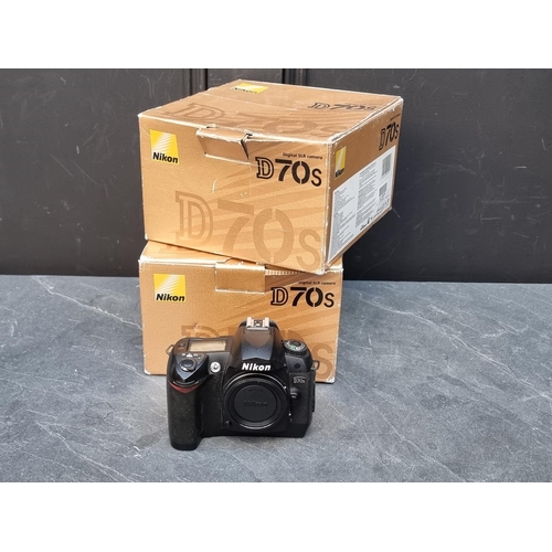 1656 - Cameras: two Nikon D70s bodies, each boxed, with battery charger and instruction manual.... 