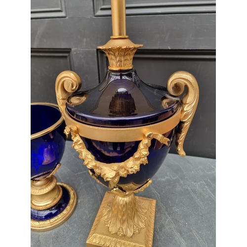 1657 - A pair of large blue glass and gilt brass table lamps, total height 82cm; together with a similar ur... 