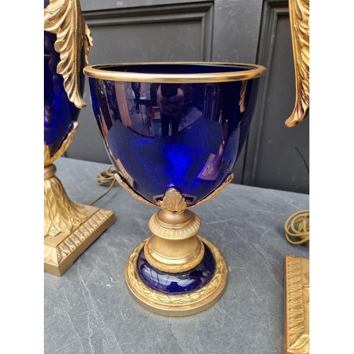 1657 - A pair of large blue glass and gilt brass table lamps, total height 82cm; together with a similar ur... 