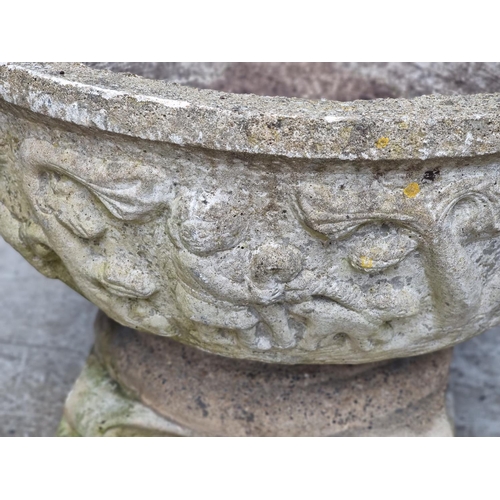 1659 - A large composition stone pedestal urn, 58cm high x 76cm diameter.