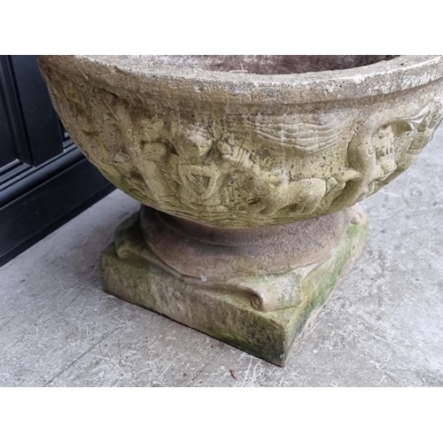 1659 - A large composition stone pedestal urn, 58cm high x 76cm diameter.