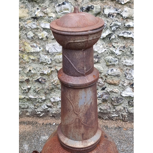 1664 - A cast iron chimenea, 122cm high.