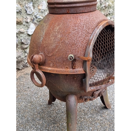 1664 - A cast iron chimenea, 122cm high.