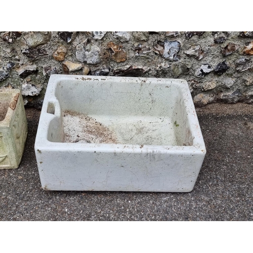 1667 - A composition stone garden planter, 79cm wide; together with a butlers sink, 61cm wide. (2)... 