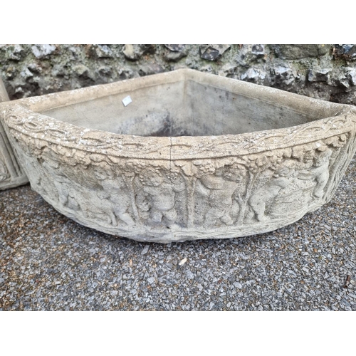 1668 - A pair of composition stone corner quadrant planters, 72cm wide. (2)