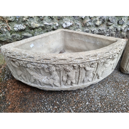 1668 - A pair of composition stone corner quadrant planters, 72cm wide. (2)