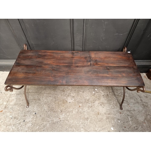 1676 - A steel and stained pine bench, 117.5cm wide.