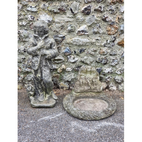 1677 - A composition stone garden figure, emblematic of winter, 76cm high; and a similar birdbath, 46cm wid... 