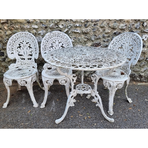 1689 - An aluminium garden table and three chairs, the table 76cm diameter. (4)