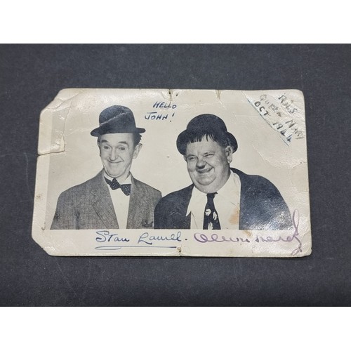 LAUREL & HARDY: a signed postcard-sized photograph of Laurel & Hardy ...