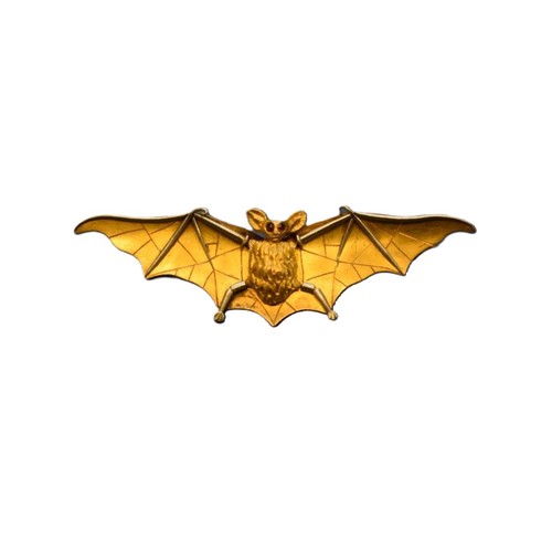 89 - An unmarked yellow & white gold bat brooch, having cabochon ruby eyes, 6cm.