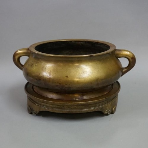 1226 - A large and impressive Chinese bronze twin handled censor and tripod stand, Xuande six character mar... 