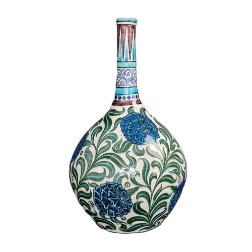 1287 - A William de Morgan pottery bottle vase, painted with Persian style flowers, 32cm high.... 