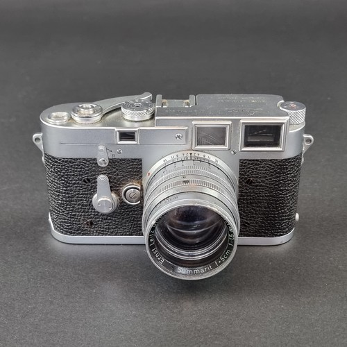 1361 - Cameras: a Leica M3, serial No.700243, in original leather case; with Leica Meter MC; and Summarit f... 