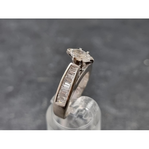 138 - A marquise diamond ring, with eighteen diamonds to shoulders, stamped '18ct', size M.... 