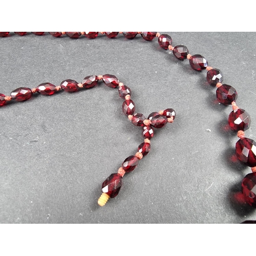 322 - A cherry amber style faceted bead necklace, having seventy three beads of approximately 5-16mm diame... 