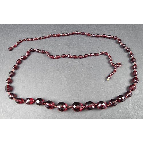 322 - A cherry amber style faceted bead necklace, having seventy three beads of approximately 5-16mm diame... 