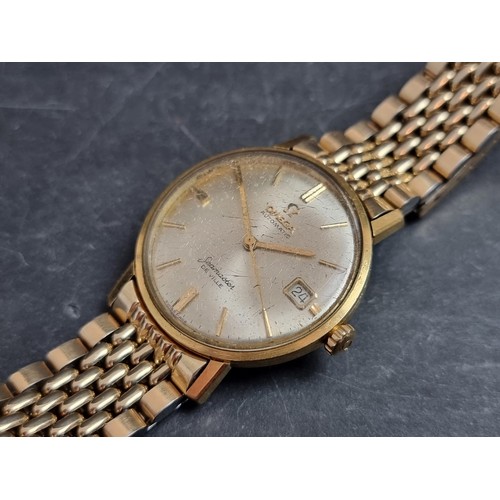 353 - A 1960s Omega 'De Ville Seamaster' 18ct gold automatic wristwatch, 34mm, Ref. 1665020, Cal. 562, on ... 