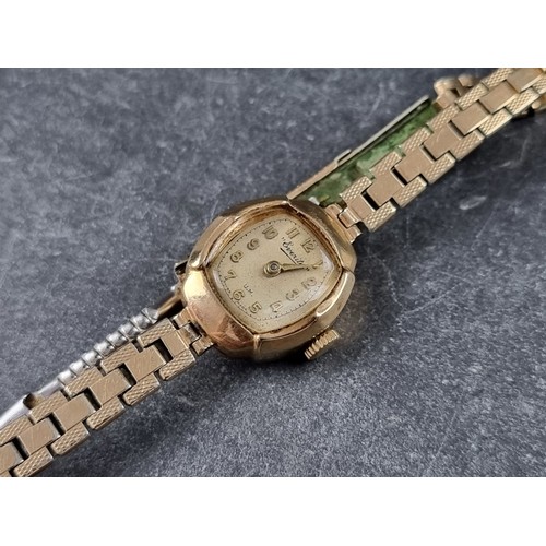 385 - A vintage Everite 9ct gold manual wind ladies wristwatch, 17mm, on rolled gold bracelet.... 