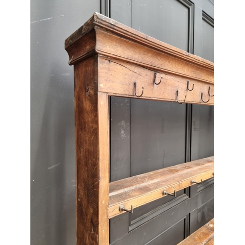 1000 - An 18th century oak potboard dresser and rack, 187.5cm wide.