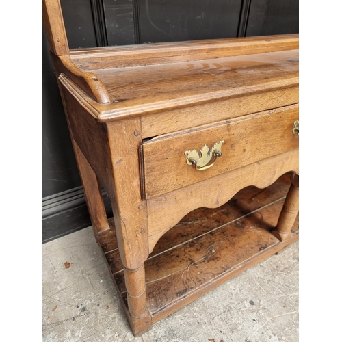 1000 - An 18th century oak potboard dresser and rack, 187.5cm wide.