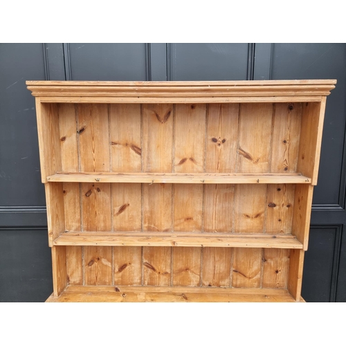 1001 - An old pine dresser and rack, 133cm wide.