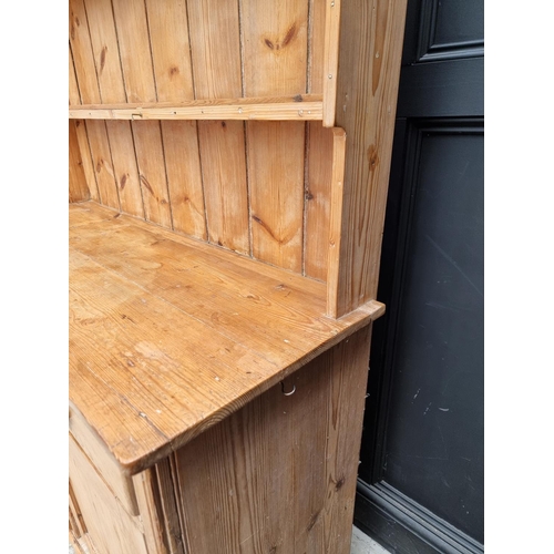 1001 - An old pine dresser and rack, 133cm wide.