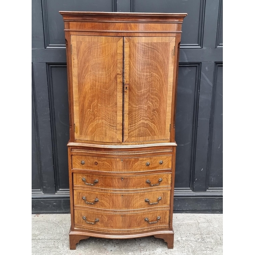 1006 - A reproduction mahogany serpentine fronted side cabinet, 70cm wide.