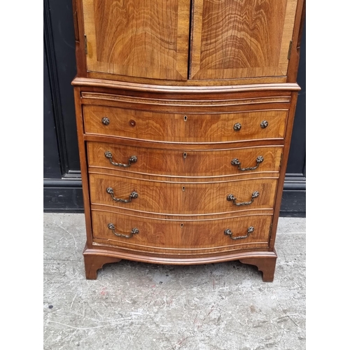 1006 - A reproduction mahogany serpentine fronted side cabinet, 70cm wide.