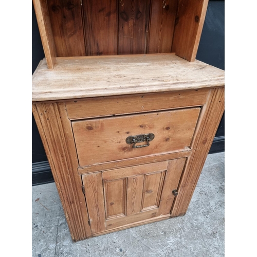 1009 - A pine cabinet, 77.5cm wide.