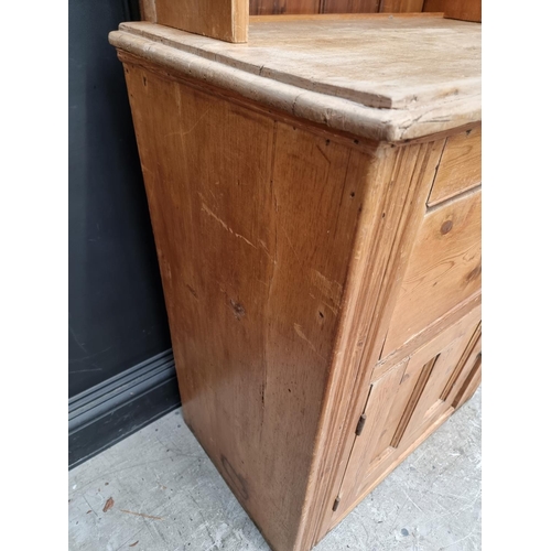 1009 - A pine cabinet, 77.5cm wide.