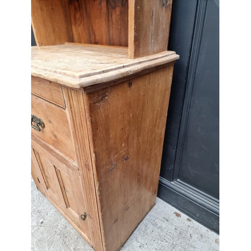 1009 - A pine cabinet, 77.5cm wide.