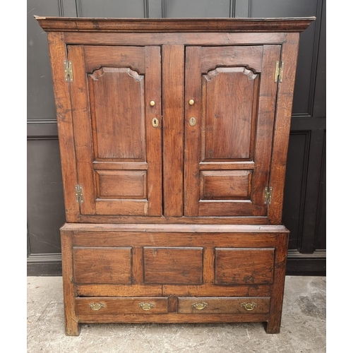 1010 - An 18th century oak panelled press cupboard, 138cm wide.