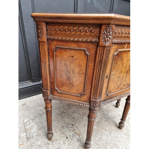 1017 - An unusual antique continental walnut corner cupboard, 88cm wide.