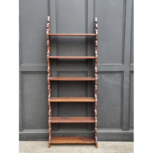 1019 - A hardwood six tier open bookshelf, 207 x 78cm.