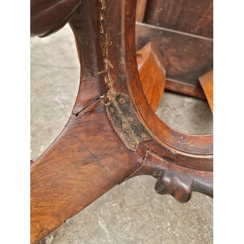 1020 - A good Victorian figured walnut oval loo table, with dolphin base, 152cm wide.