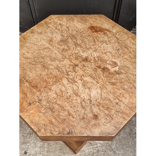 1023 - An Art Deco burr walnut octagonal low table, 58.5cm wide.