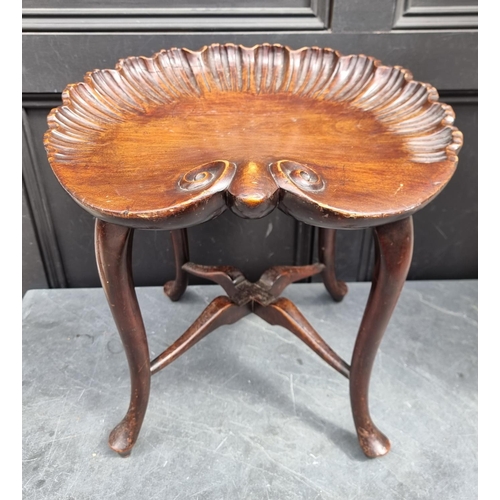 1029 - A Renaissance style carved walnut shell stool, bearing bone label inscribed 'W F Greenwood & Son... 