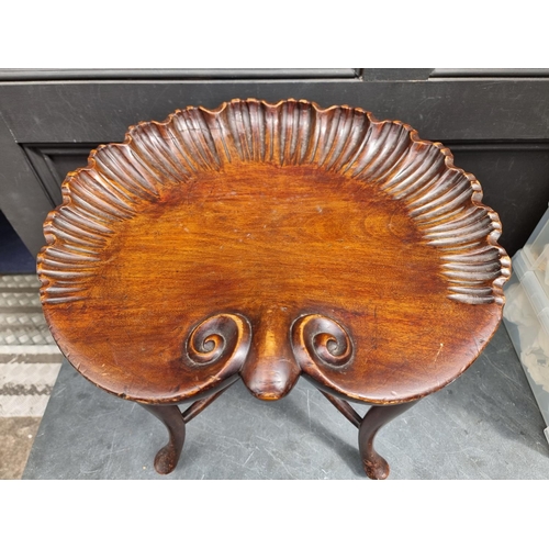 1029 - A Renaissance style carved walnut shell stool, bearing bone label inscribed 'W F Greenwood & Son... 