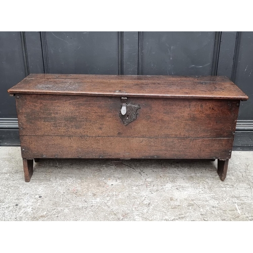 1034 - A late 17th century oak boarded coffer, 122cm wide.