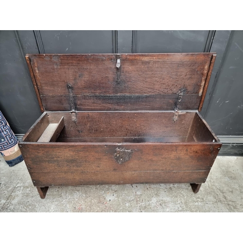 1034 - A late 17th century oak boarded coffer, 122cm wide.