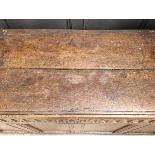 1038 - A large late 17th century oak panelled coffer, 162cm wide, (old alterations to top).... 