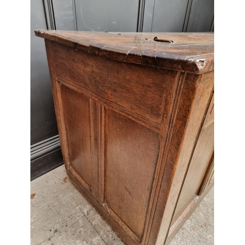 1038 - A large late 17th century oak panelled coffer, 162cm wide, (old alterations to top).... 