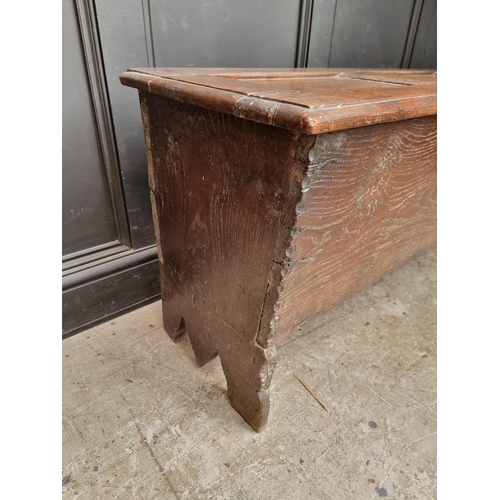 1039 - An unusual 17th century elm and oak boarded coffer, of tapered profile, 152.5cm wide.... 