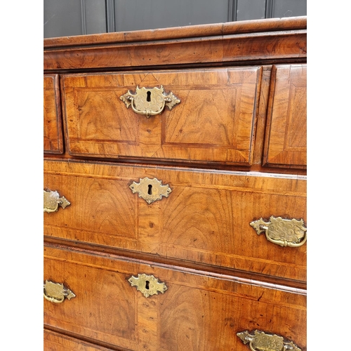 1043 - A George I/II walnut and feather banded chest on chest, 97.5cm wide.